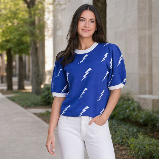 Blue Air Force Academy knit sweater top with white lightning bolts, puff sleeves and white ribbed trim