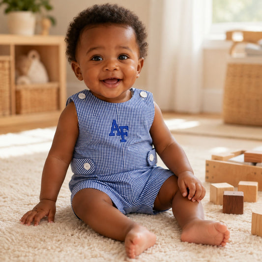Air Force Academy toddler shortall in blue-and-white gingham with embroidered AF logo and button details.