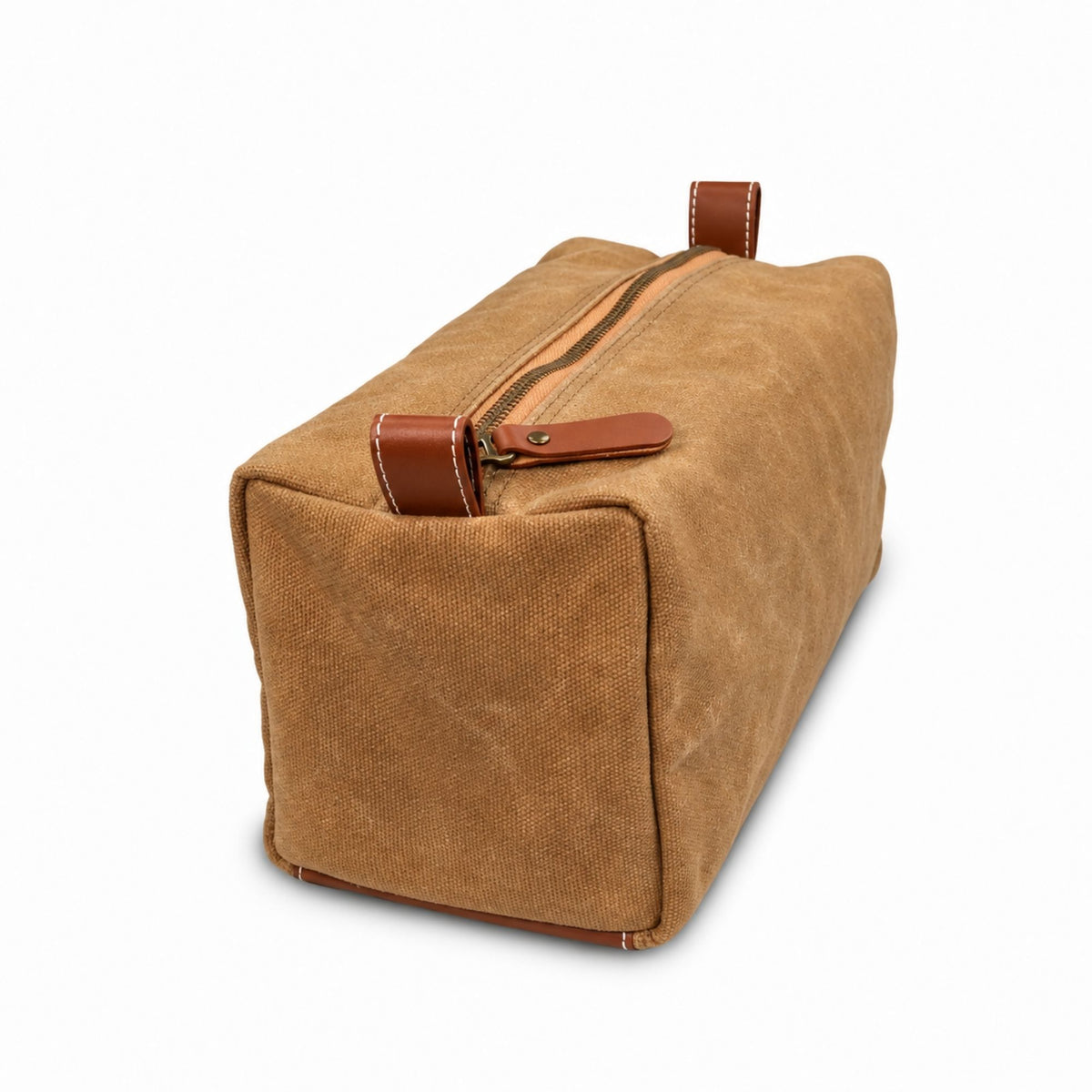 Side view of the Air Force waxed canvas dopp kit showing the zipper, leather pull tabs and textured canvas construction.