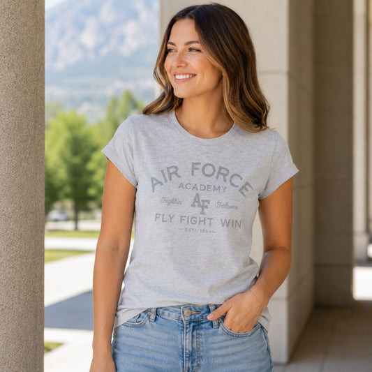 Women's silver heather Air Force Academy Fly Fight Win tee featuring a distressed tonal vintage collegiate graphic on the front.