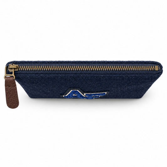 Top view of the blue Melton Wool Valuables Pouch with an antique brass zipper and brown leather pull.