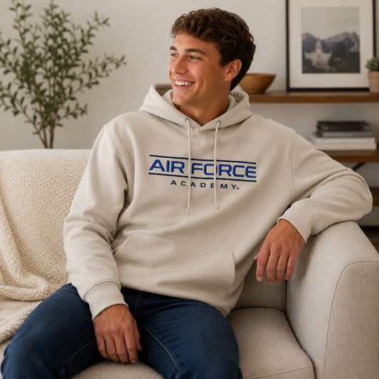 Men's cream Monterey Lounge Air Force Academy hoodie featuring an embroidered Air Force Academy design, scuba knit fabric, kangaroo pocket, and drawstring hood.