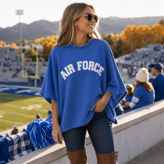 Royal blue Varsity Chenille Poncho with oversized white AIR FORCE chenille lettering and a distressed neckline.