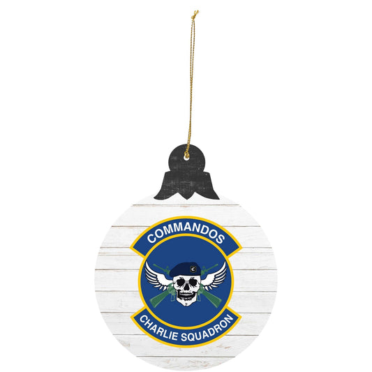 USAFA Prep School Charlie Squadron ‘Commandos’ tree ornament featuring skull and wings emblem on white wood-style background.