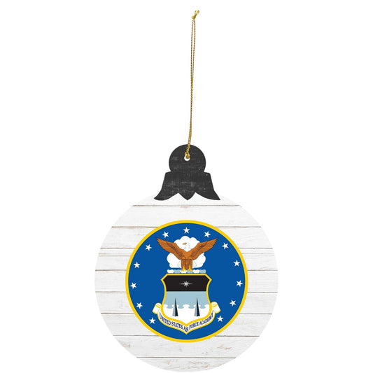 U.S. Air Force Academy Coat of Arms tree ornament with blue crest on white wood background