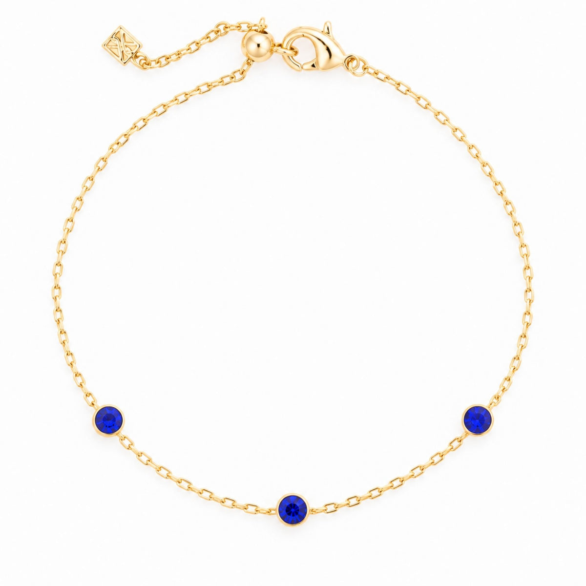 Academy Gemstone Bracelet with three royal-blue glass stones set along a delicate 18K gold-plated chain.