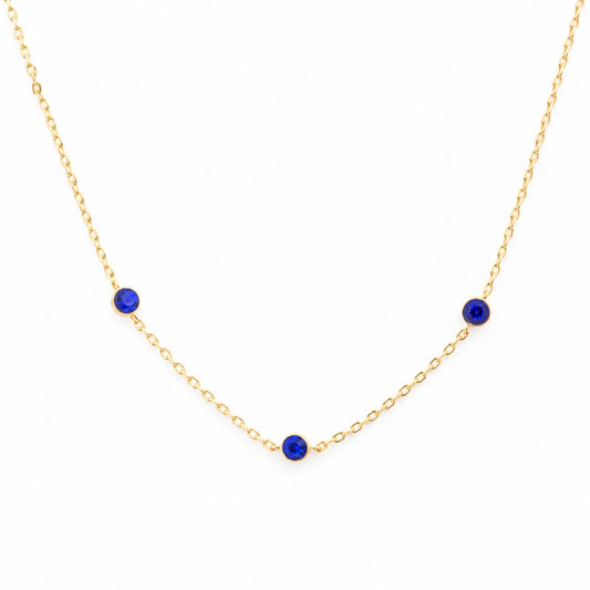 Academy Gemstone Necklace with three royal-blue glass stones set along a delicate 18K gold-plated chain.