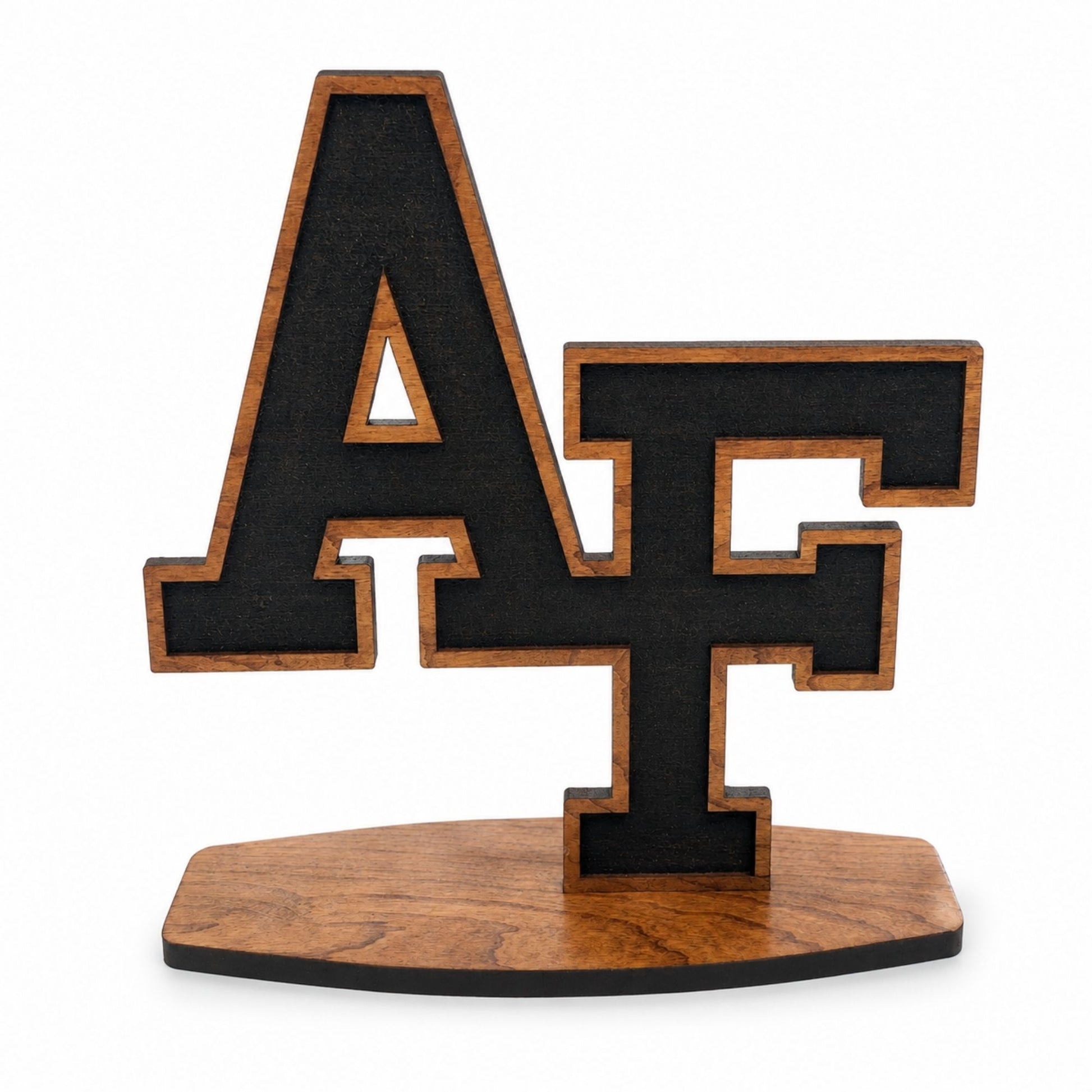 Cherry wood AF desk sitter featuring the iconic interlocking Air Force letters on a freestanding wooden base.