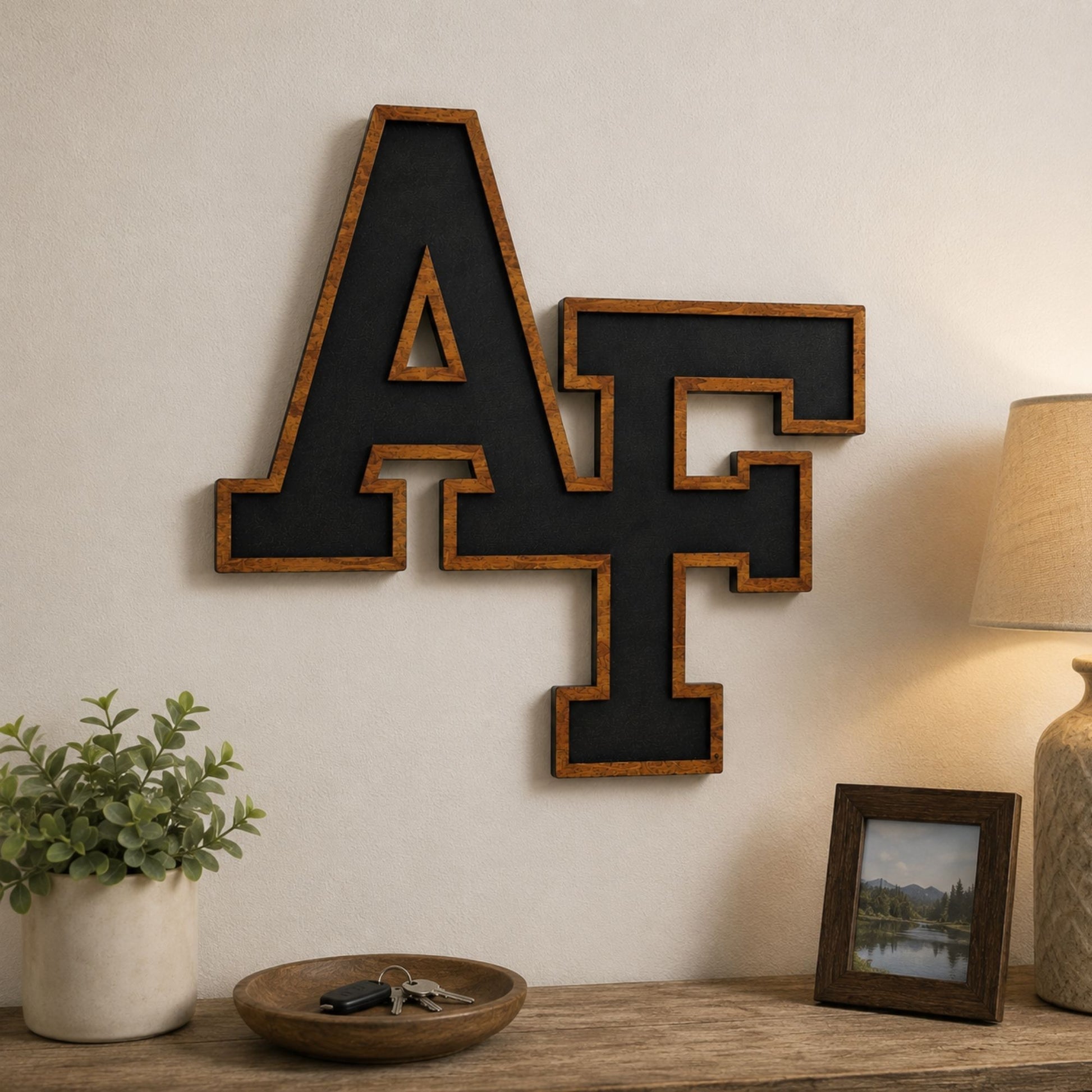 Cherry wood AF wall hanger featuring the iconic interlocking Air Force letters with a black inset design.