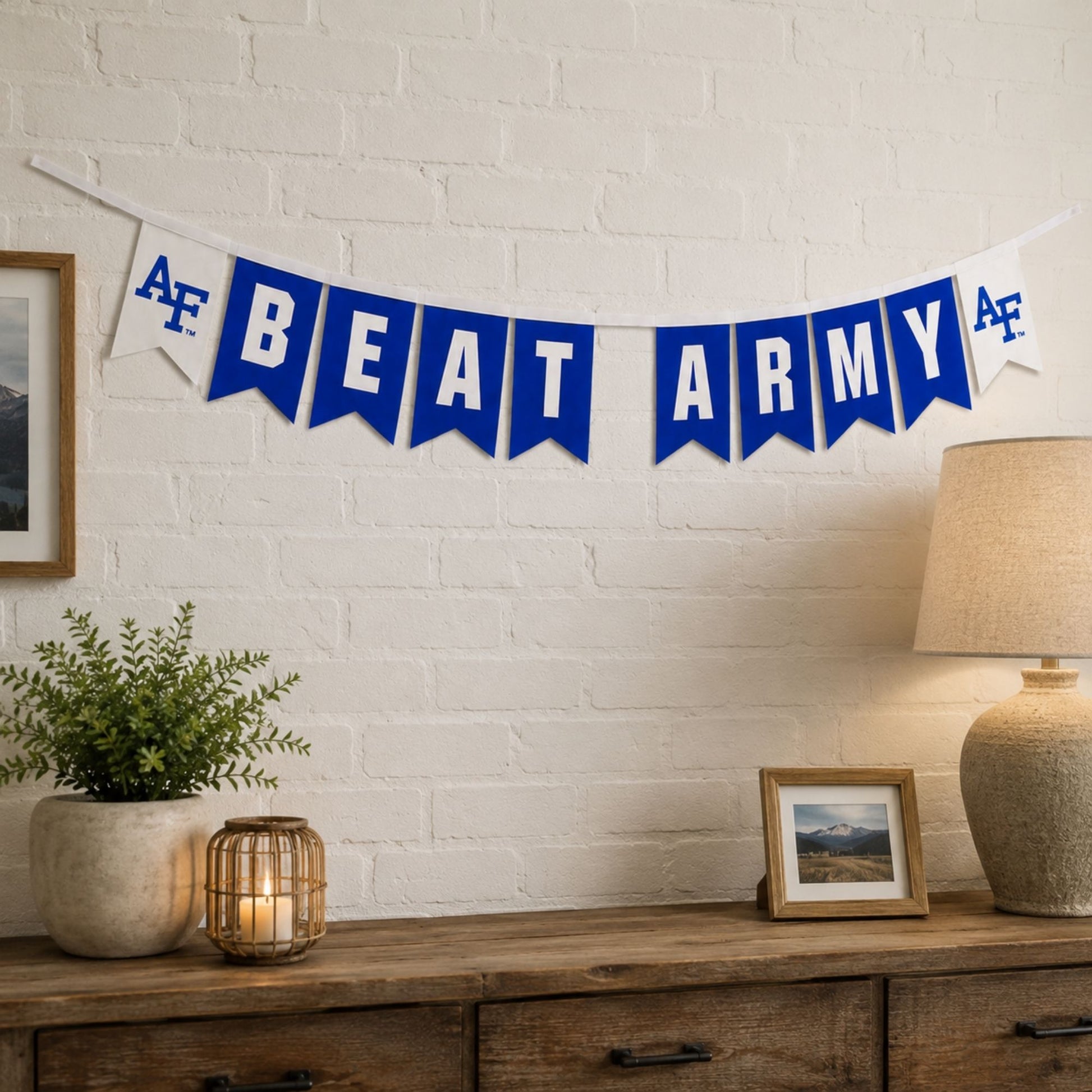 Air Force Academy Beat Army felt banner with royal blue and white pennants connected by a white grosgrain ribbon