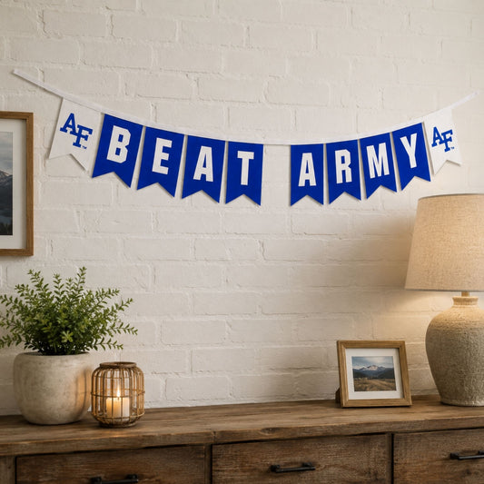 Air Force Academy Beat Army felt banner with royal blue and white pennants connected by a white grosgrain ribbon