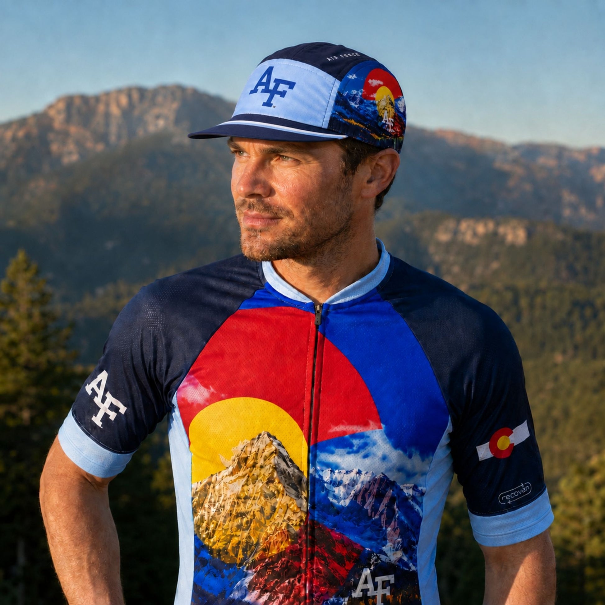 Navy and light-blue Air Force Academy cycling hat with AF logos, Colorado mountain graphics, a striped extended bill, and a foldable design.