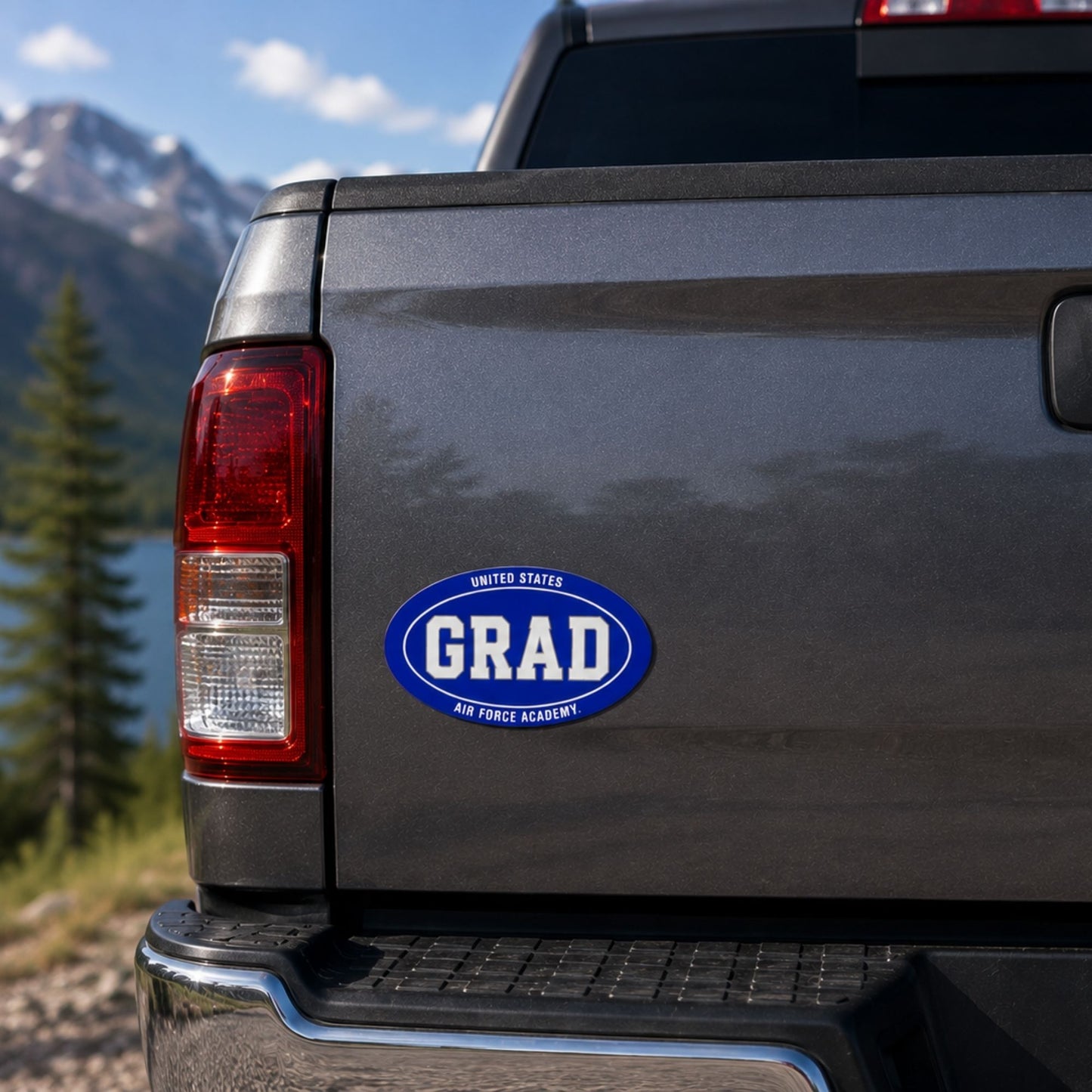 Air Force Academy GRAD auto magnet in royal blue and white measuring 6 inches wide by 4 inches high.