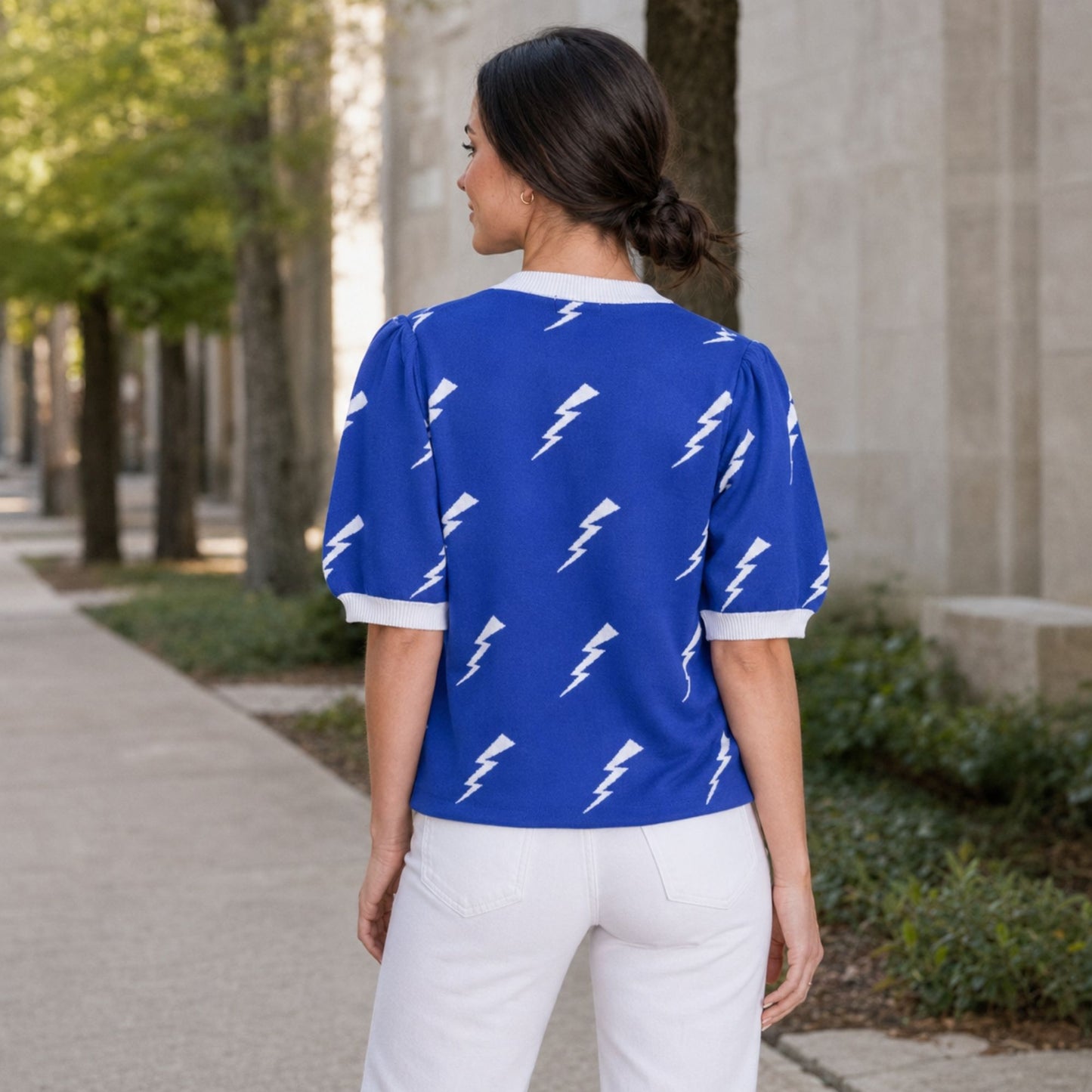 Blue Air Force Academy knit sweater top with white lightning bolts, puff sleeves and white ribbed trim