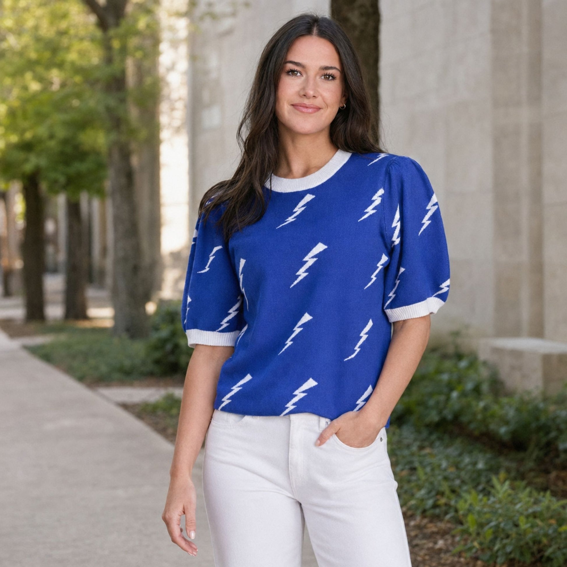 Blue Air Force Academy knit sweater top with white lightning bolts, puff sleeves and white ribbed trim