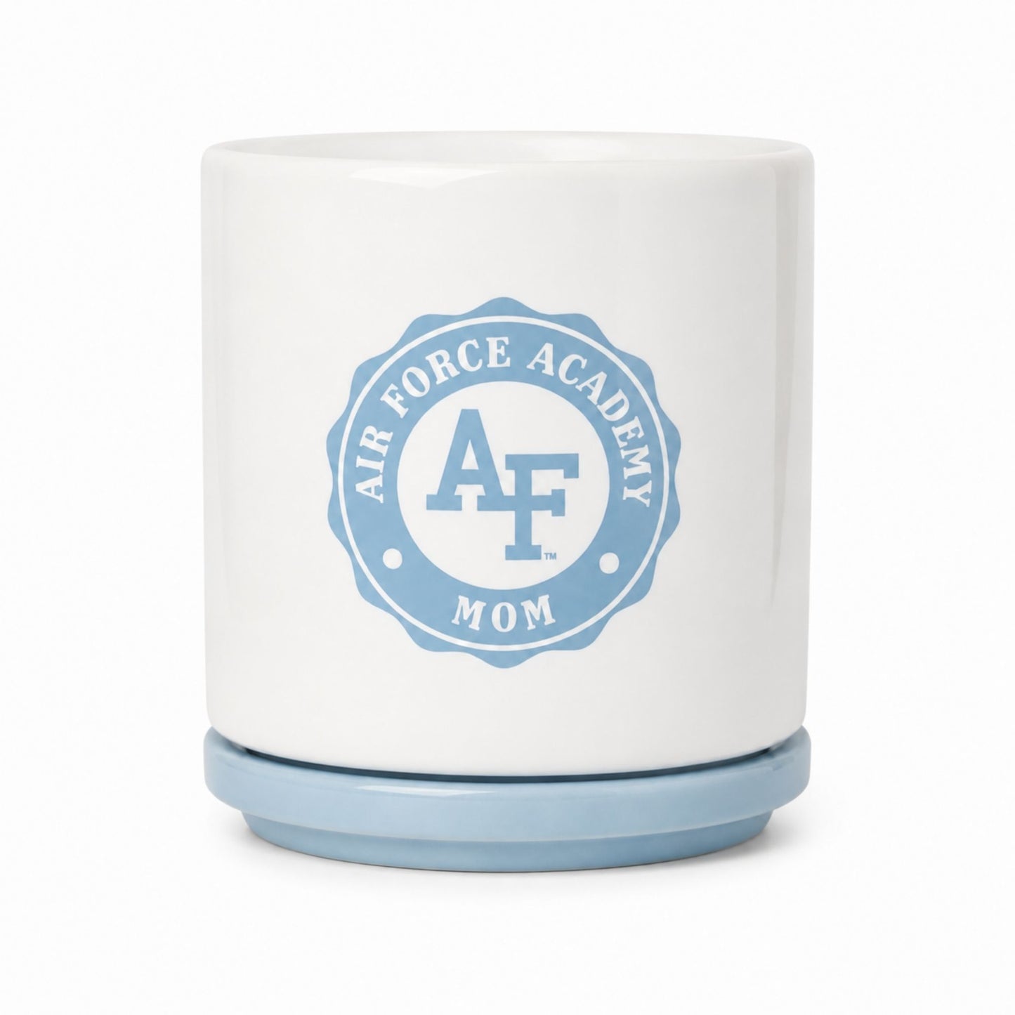 White ceramic Air Force Academy Mom planter with a cloud blue drainage plate featuring the Air Force Academy Mom emblem.