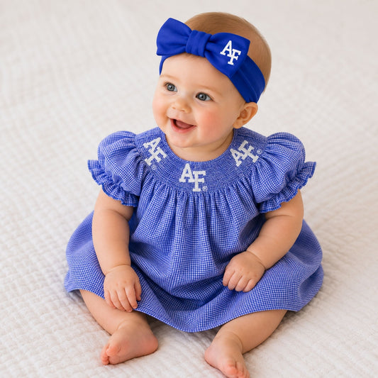 Royal blue Air Force baby hair bow headband featuring a large bow and white AF logo