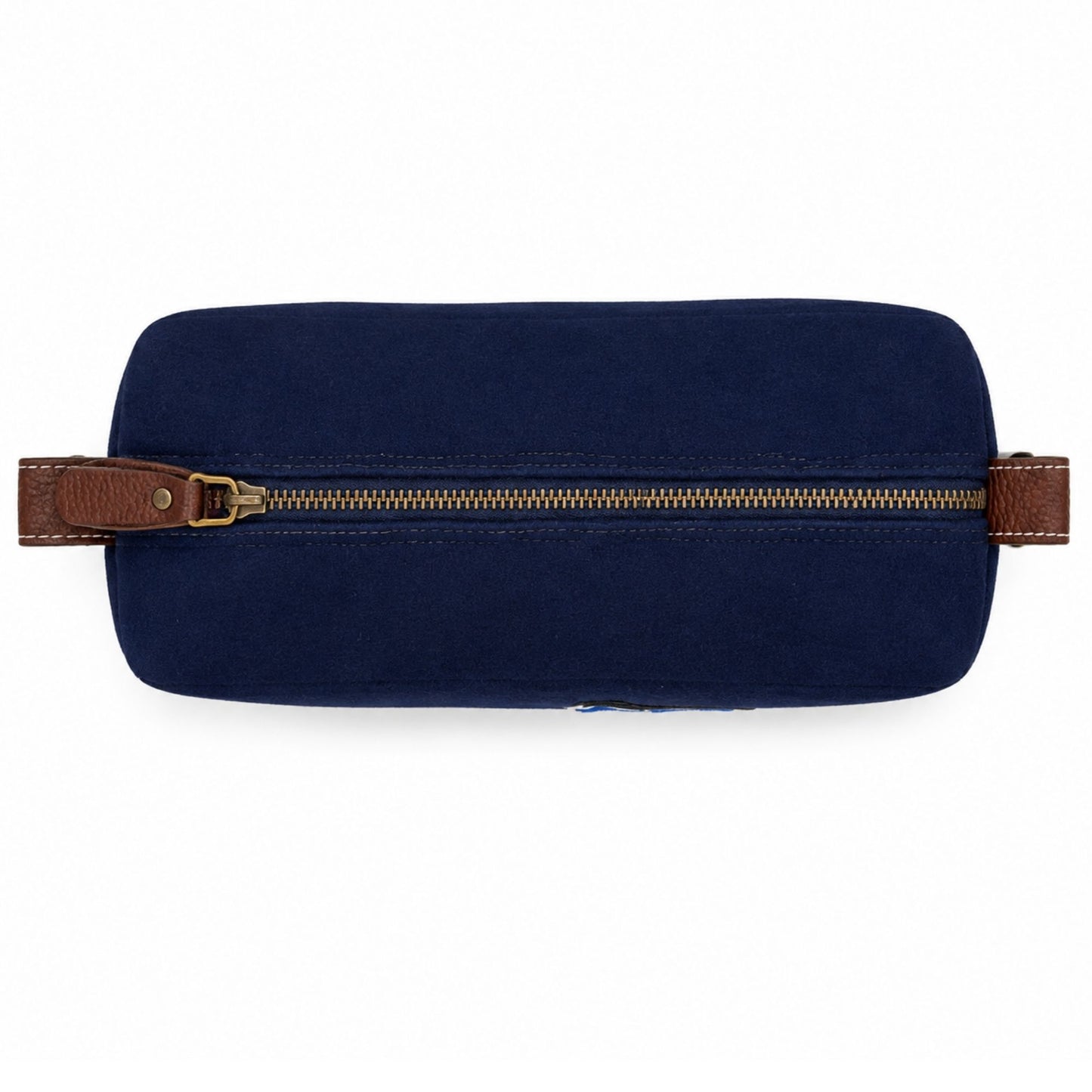 Top view of the navy Air Force Wool Dopp Kit featuring a brass zipper and brown pebbled leather trim.