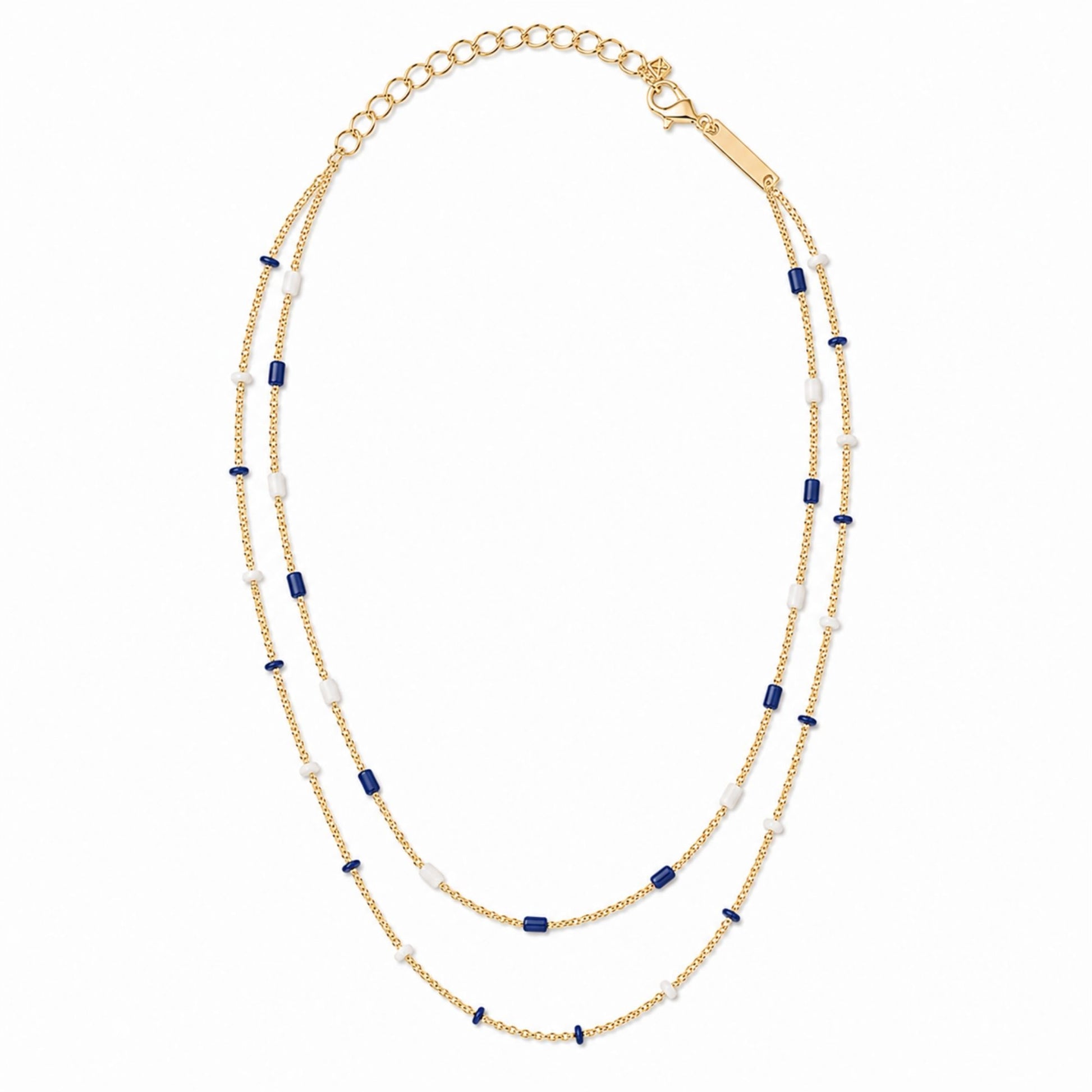 Gold-tone double strand beaded necklace with alternating royal blue and white beads