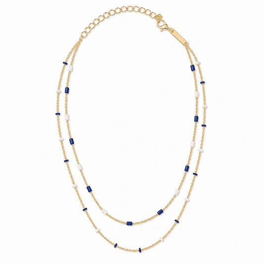 Gold-tone double strand beaded necklace with alternating royal blue and white beads