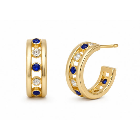 Gold-tone hoop earrings with alternating blue and clear rhinestones