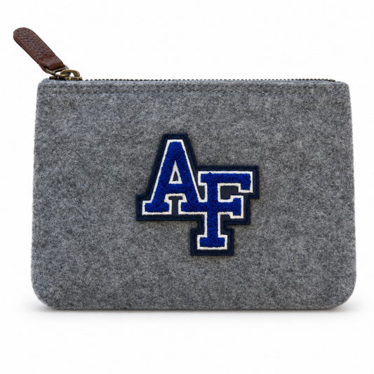 Front view of the grey Melton Wool Valuables Pouch featuring a chenille AF logo and brown leather zipper pull.