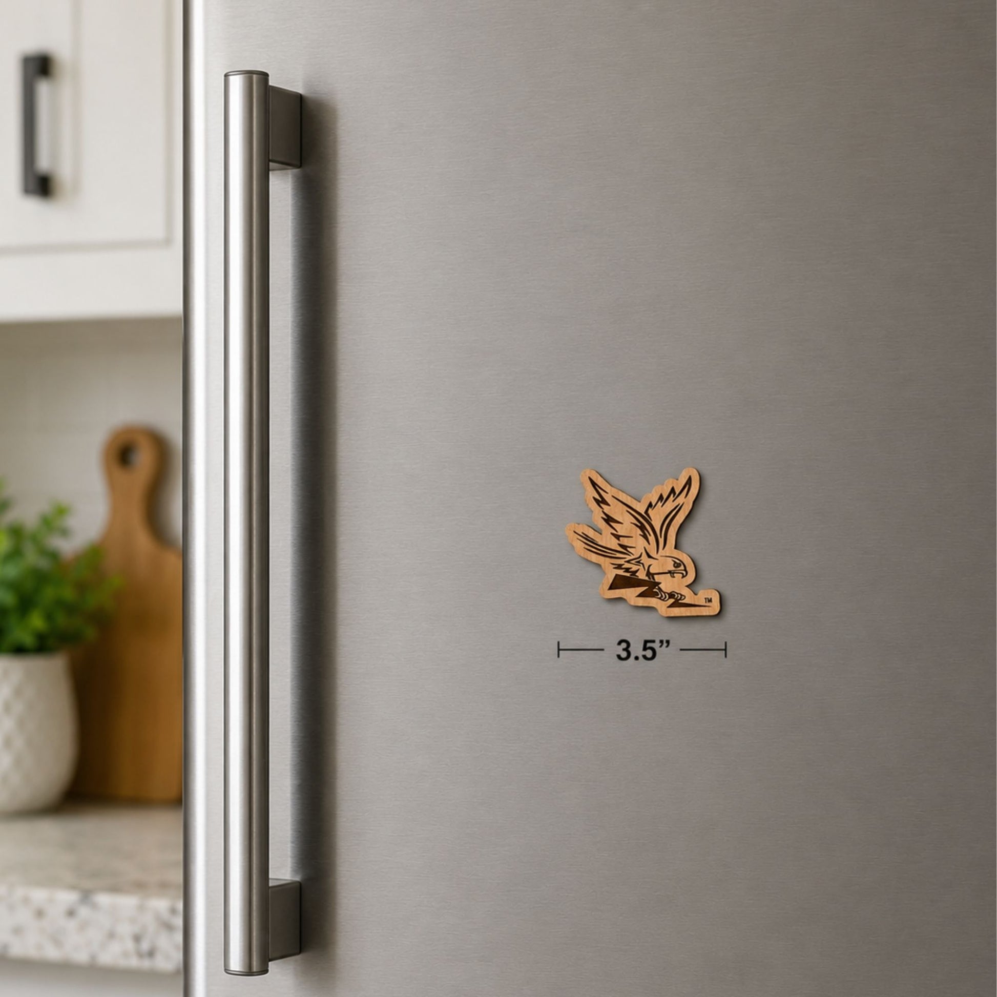 Laser-engraved Spirit Falcon wooden magnet featuring natural wood grain and detailed Air Force Academy falcon artwork.